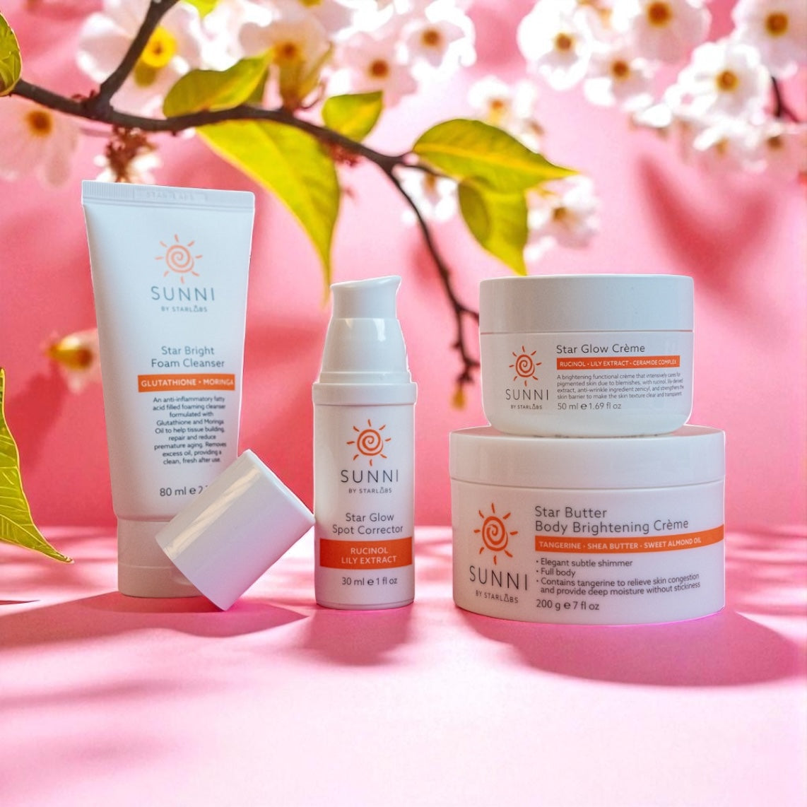 Starlabs Sunni skincare products on a pink background with cherry blossoms