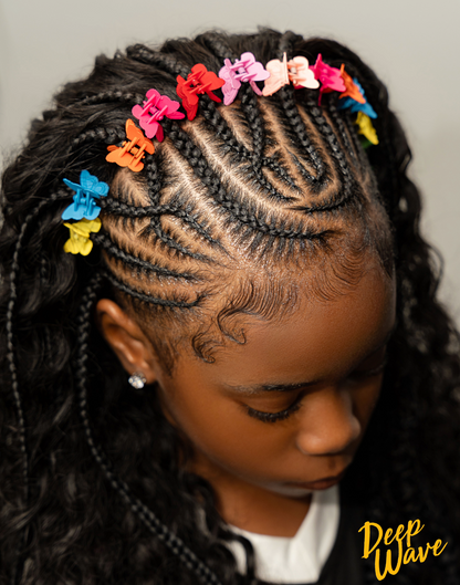 A close-up of a child with intricate cornrow braids decorated with colorful butterfly hair clips in pink, red, orange, yellow, and blue. The child is looking down, and the 'Deep Wave' brand logo is visible in the bottom right corner.