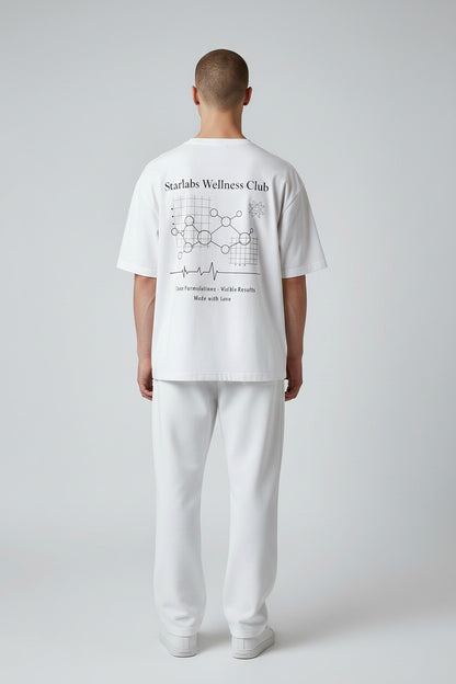 Person wearing a white t-shirt with 'Starlabs Wellness Club' design on a plain background