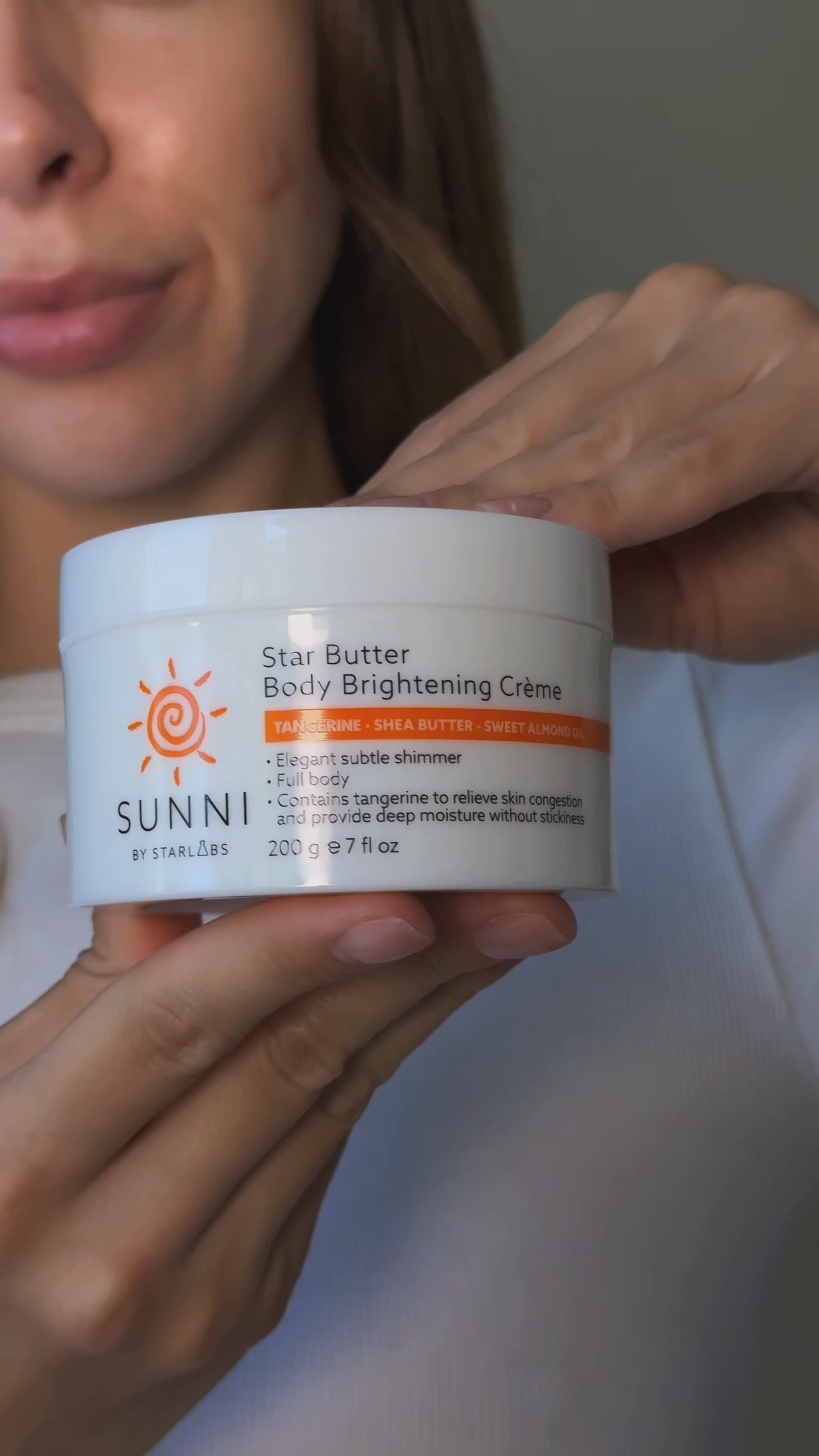 Load video: Woman using Star Butter Body Brightening Creme